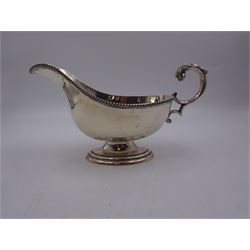 1930s silver sauce boat, of typical form, with oblique gadrooned rim and acanthus capped flying C scroll handle, by William Hutton & Sons Ltd, Sheffield 1934, H11cm