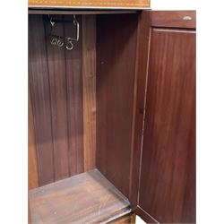 Edwardian inlaid mahogany double wardrobe, panelled doors enclosing sliding trays and hanging rail, fitted with single drawer to base