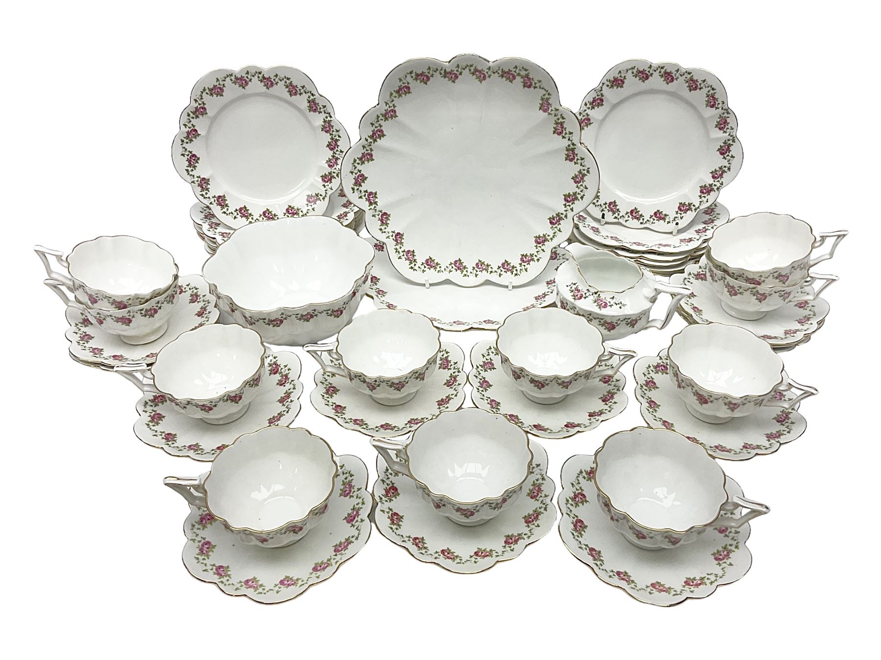 Shelley Late Foley part tea service, pattern number 10137, decorated with roses, comprising eleven teacups and twelve saucers, milk jug, sugar bowl, twelve side plates and two sandwich plates (39)