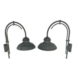 Two grey outdoor metal lamps, arched form with circular shades