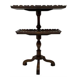 20th century yew wood two-tier stand or occasional table, quarter-matched veneer tops with shaped galleries, on turned columns with splayed moulded supports, with label underneath inscribed 'W. Charles Tozer, 5 Brook Street London'