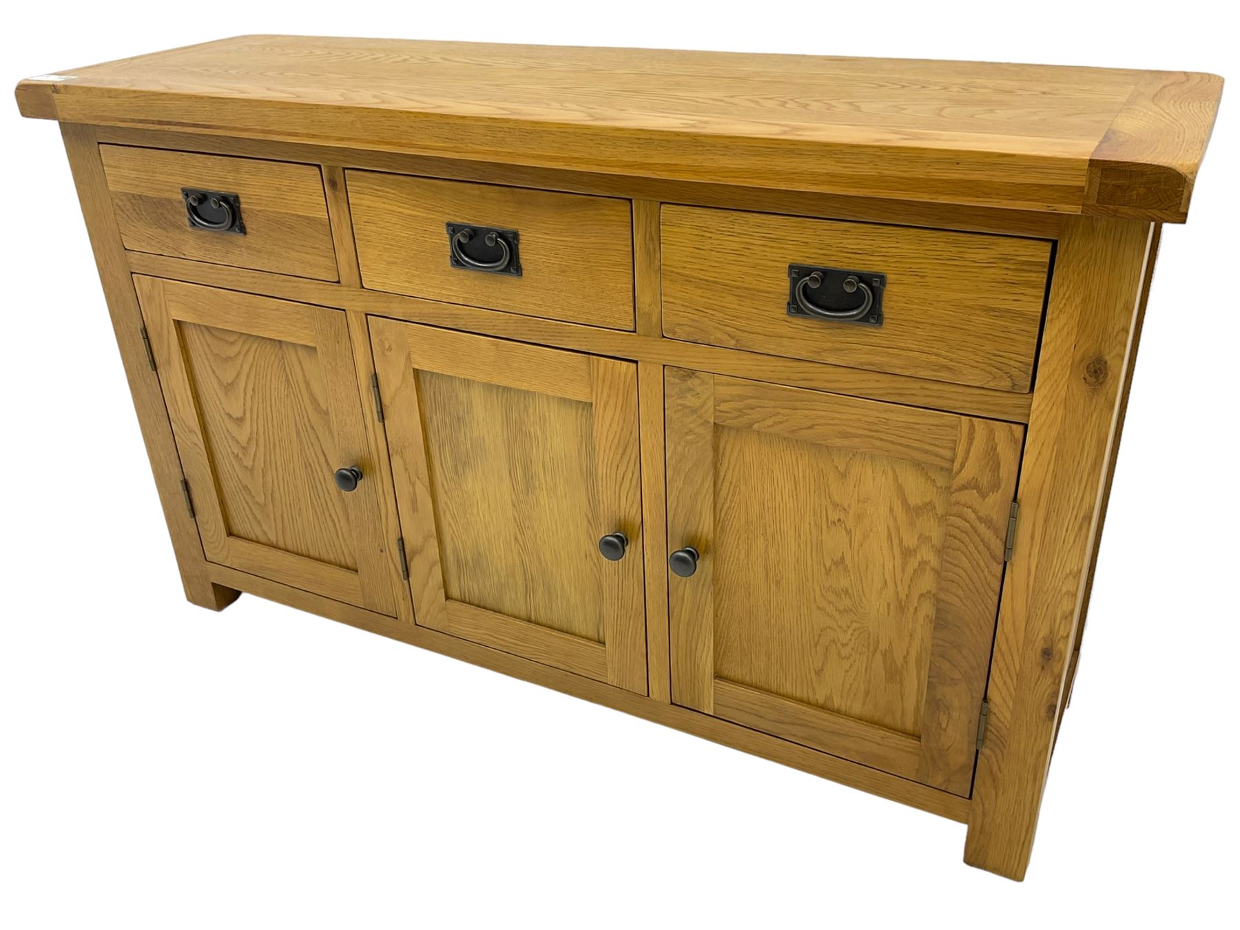 Contemporary light oak sideboard, fitted with three drawers over three panelled cupboards enclosing shelving, on square supports