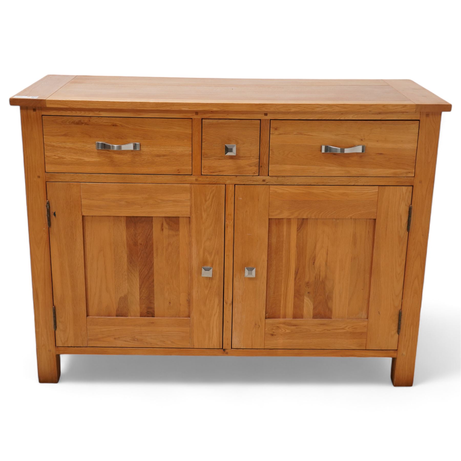 Light oak sideboard, fitted with three drawers and two cupboards