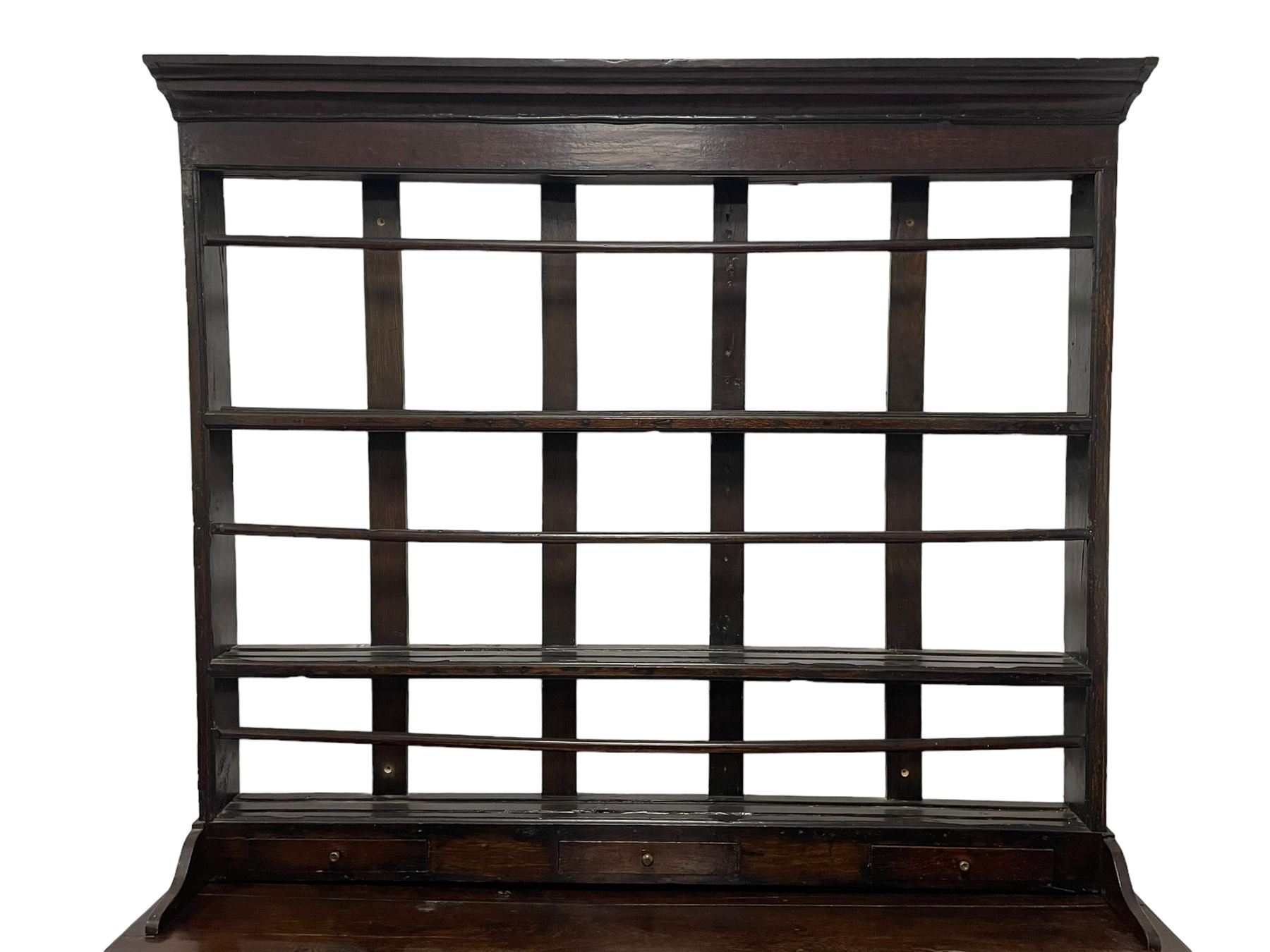 18th century oak dresser, projecting cornice over three heights plate rack with three small drawers, rectangular ovolo-moulded top over three central drawers and two flanking cupboards, enclosed by fielded panelled doors, on stile supports 