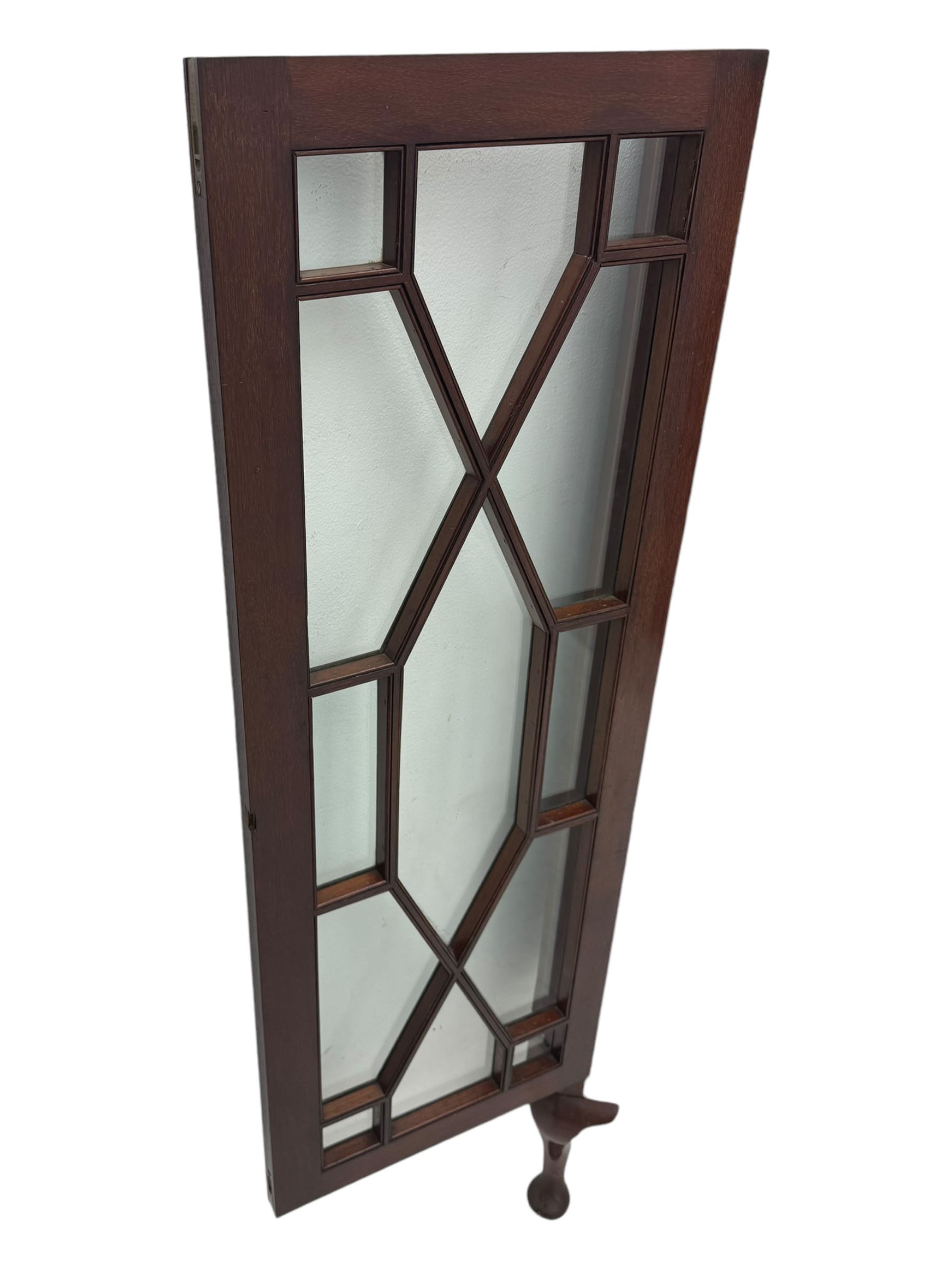 Edwardian mahogany corner cabinet, projecting cornice over inlaid frieze, two astragal glazed doors enclosing shelved interior, on cabriole supports