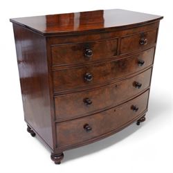 19th century mahogany bow-fronted chest, two short over three long drawers, on turned feet...