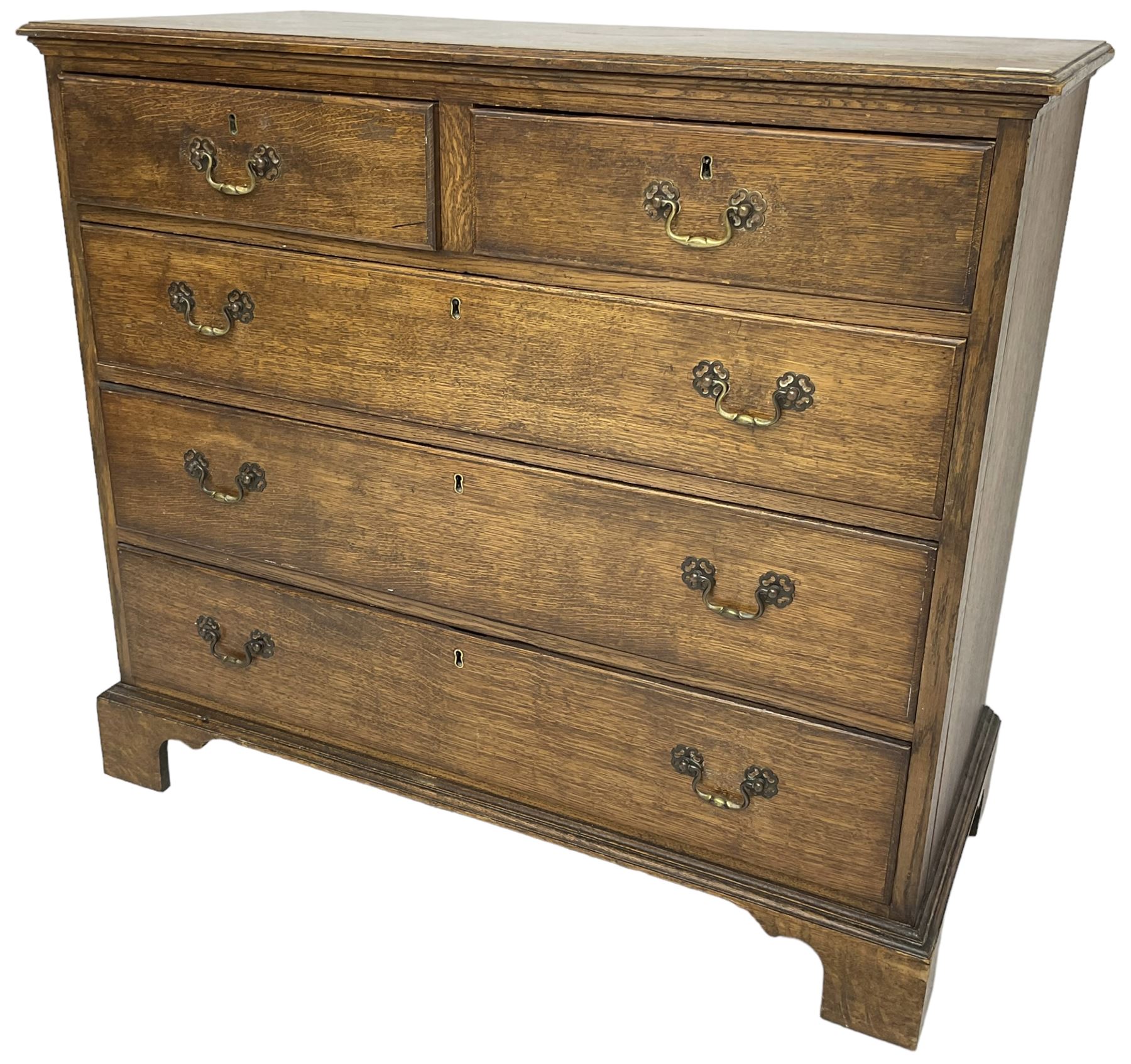 Early 20th century Georgian design oak chest, fitted with two short over three long drawers, lower moulded edge over bracket feet