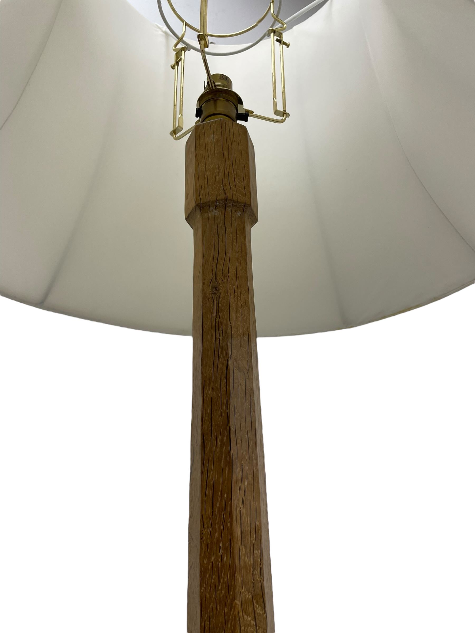 Mouseman - oak standard lamp, octagonal tapered stem on stepped and moulded octagonal base, carved with mouse signature, by the workshop of Robert Thompson, Kilburm 