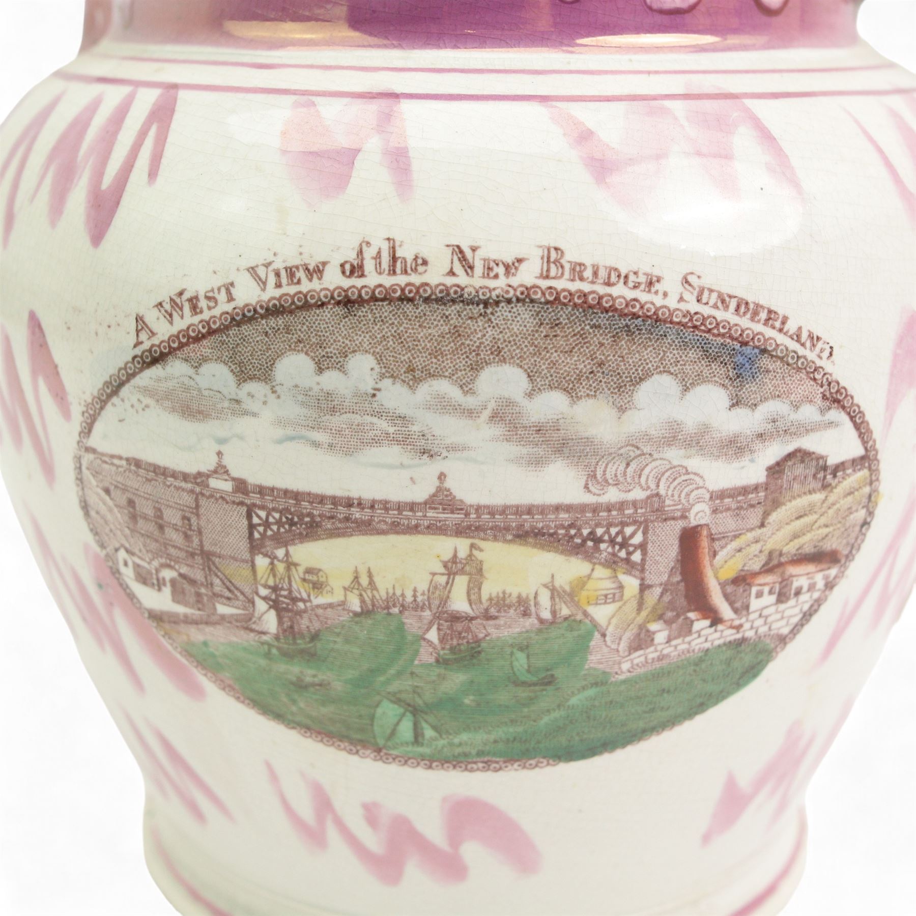 Two 19th century Sunderland lustre jugs, each transfer printed and painted in enamels, the first decorated with 'a West View of the Iron Bridge over the Wear', 'Mariners Arms' and verse, the second with 'A West View of the New Bridge Sunderland' and verse, H20cm max (2)