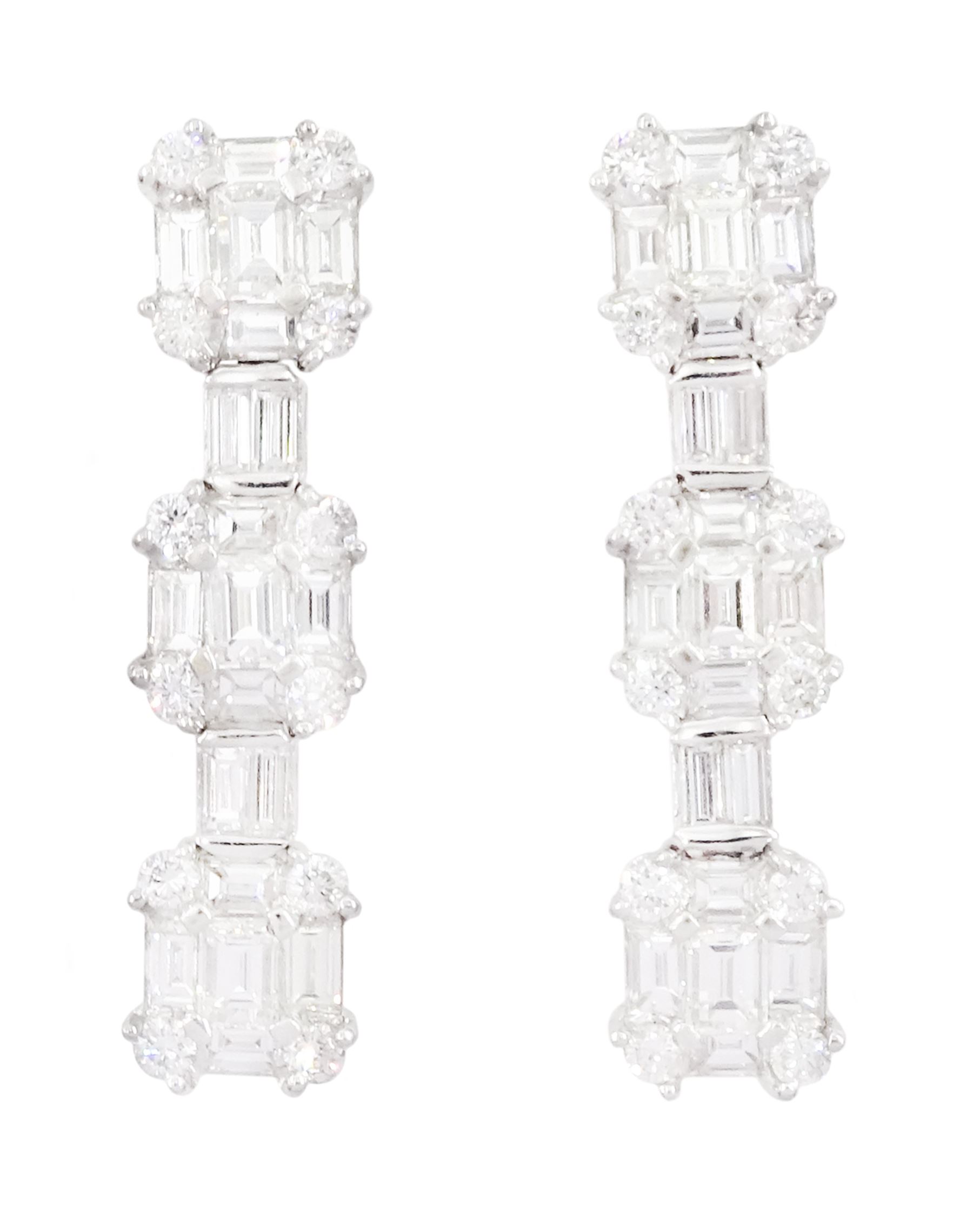 Pair of 18ct white gold baguette cut and round brilliant cut diamond stud earrings, hallmarked, total diamond weight approx 2.50 carat