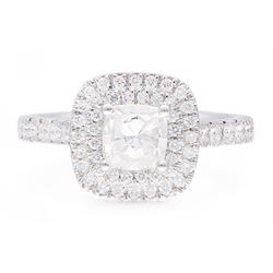 Platinum diamond halo cluster ring, the principal cushion cut diamond of 1.00 carat, with round brilliant cut diamond surround and diamond set shoulders, hallmarked, total diamond weight approx 1.45 carat