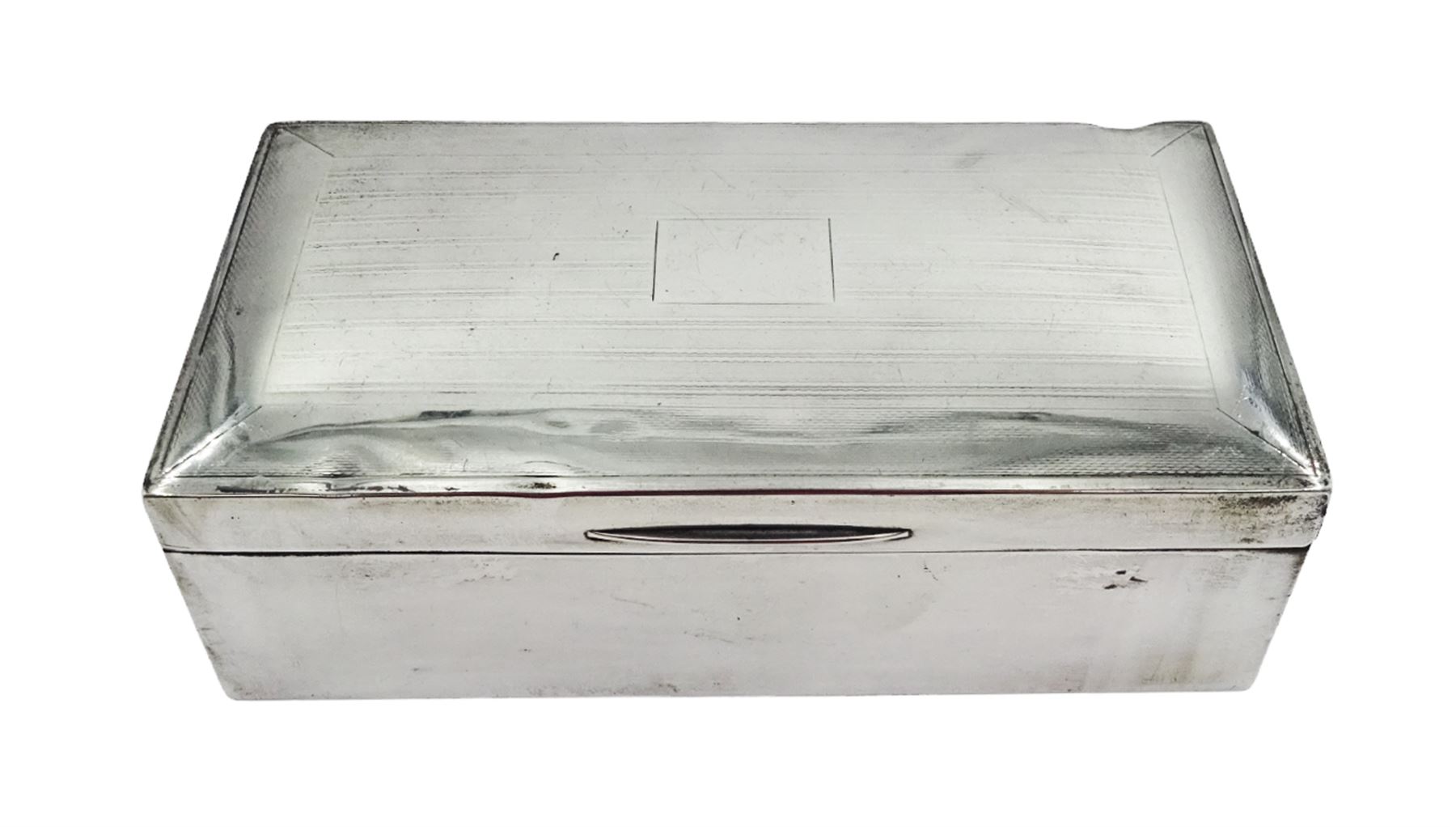 Mid 20th century silver mounted cigarette box, of rectangular form with engine turned decoration and blank cartouche to hinged cover, opening to reveal a softwood lined compartmentalised interior, hallmarked John Rose, Birmingham 1945, H5cm, W16.5cm