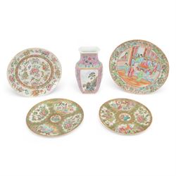 Pair of famille rose plates, the panels decorated with figures and birds in blossoming bra...