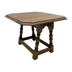 20th century oak drop-leaf table, bevel edged square top with cut corners, raised on splayed turned baluster supports united by stretchers