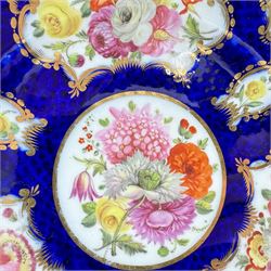 Pair of early 19th century plates, each painted with summer flowers within gilt fan shaped reserves, against a blue scale ground, unmarked, D19cm, together with a 19th century English porcelain plate, pattern no. 2/1078 (3)