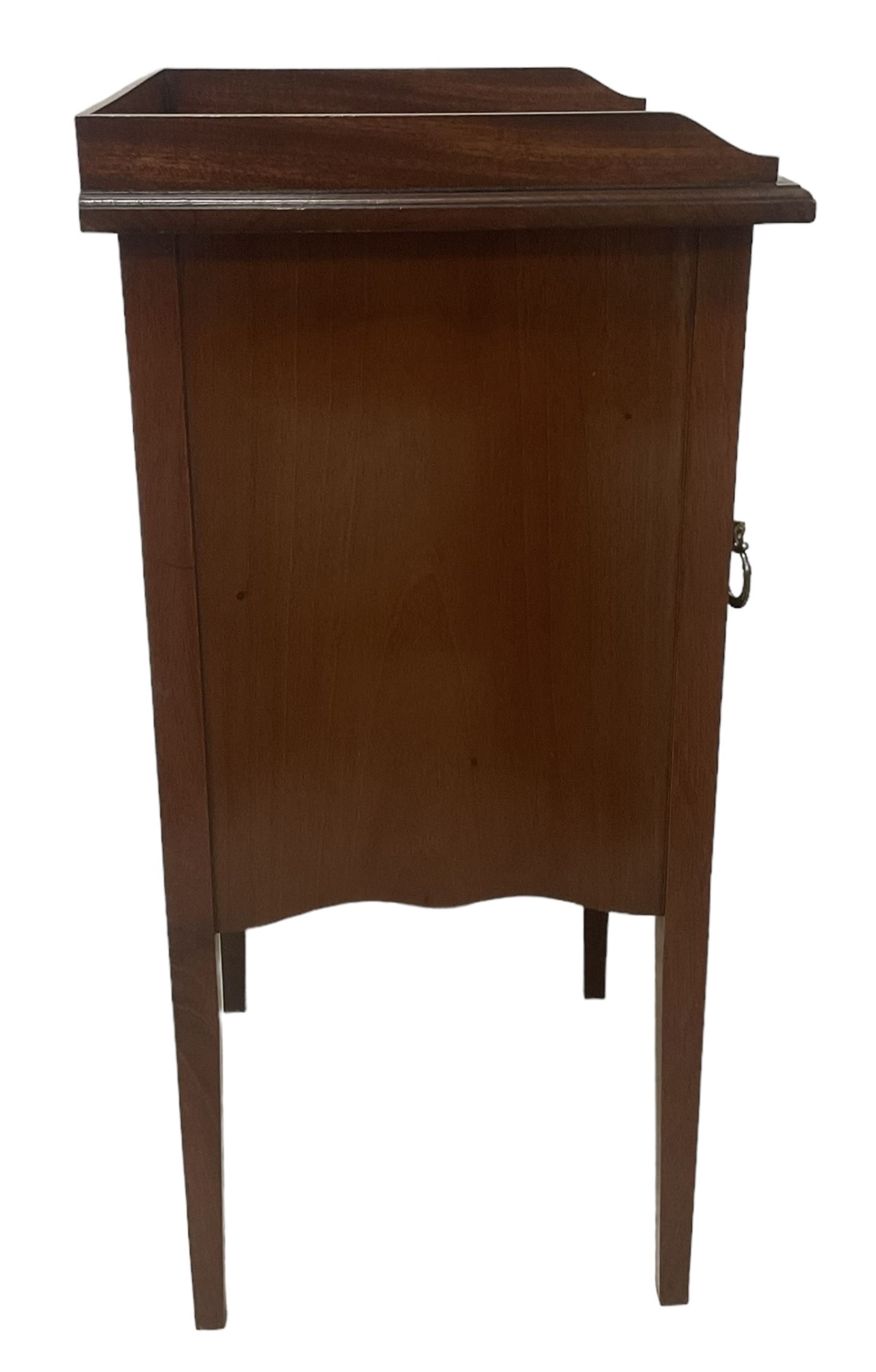 Edwardian inlaid mahogany pot cupboard, raised three-quarter gallery back, panelled door with fan inlay enclosing single shelf