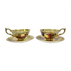 Pair Aynsley Orchard Gold pattern teacups and saucers with gilt interior 