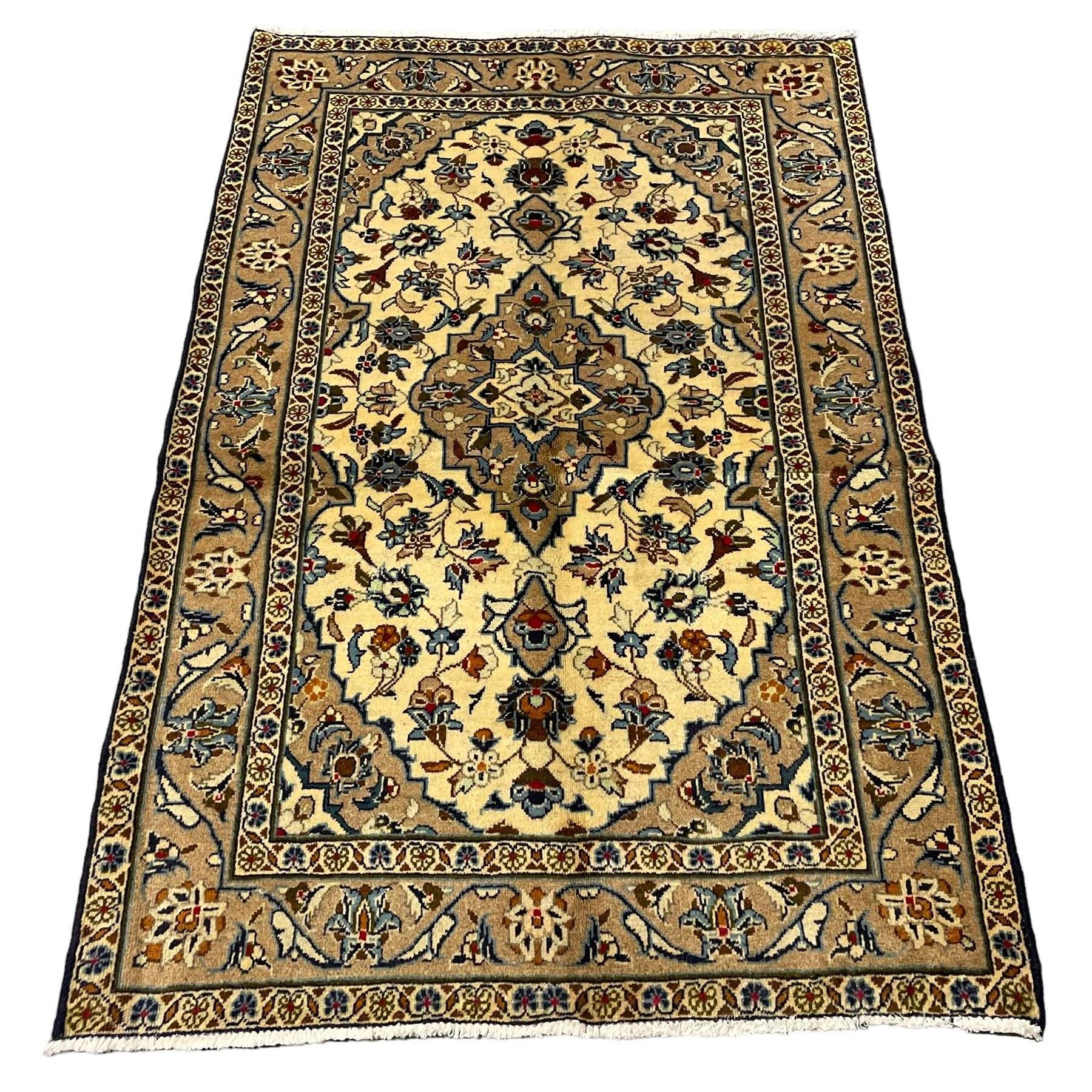 Small Persian Kashan rug, the field decorated with central medallion surrounded by stylised plant motifs, guarded border decorated with floral motifs and trailing leafy branch