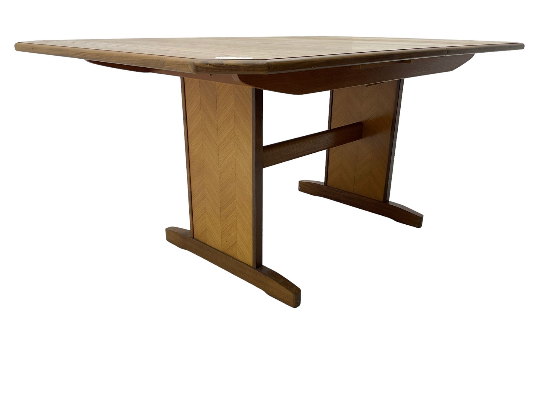 G-Plan -  1970s teak extending dining table, pull-out extending action with fold-out leaf, rectangular end supports on sledge feet united by stretcher (100cm x 160cm - 205cm, H73cm); set of six dining chairs, chevron-patterned backrests upholstered with floral patterned fabric, on tapered legs, H89cm