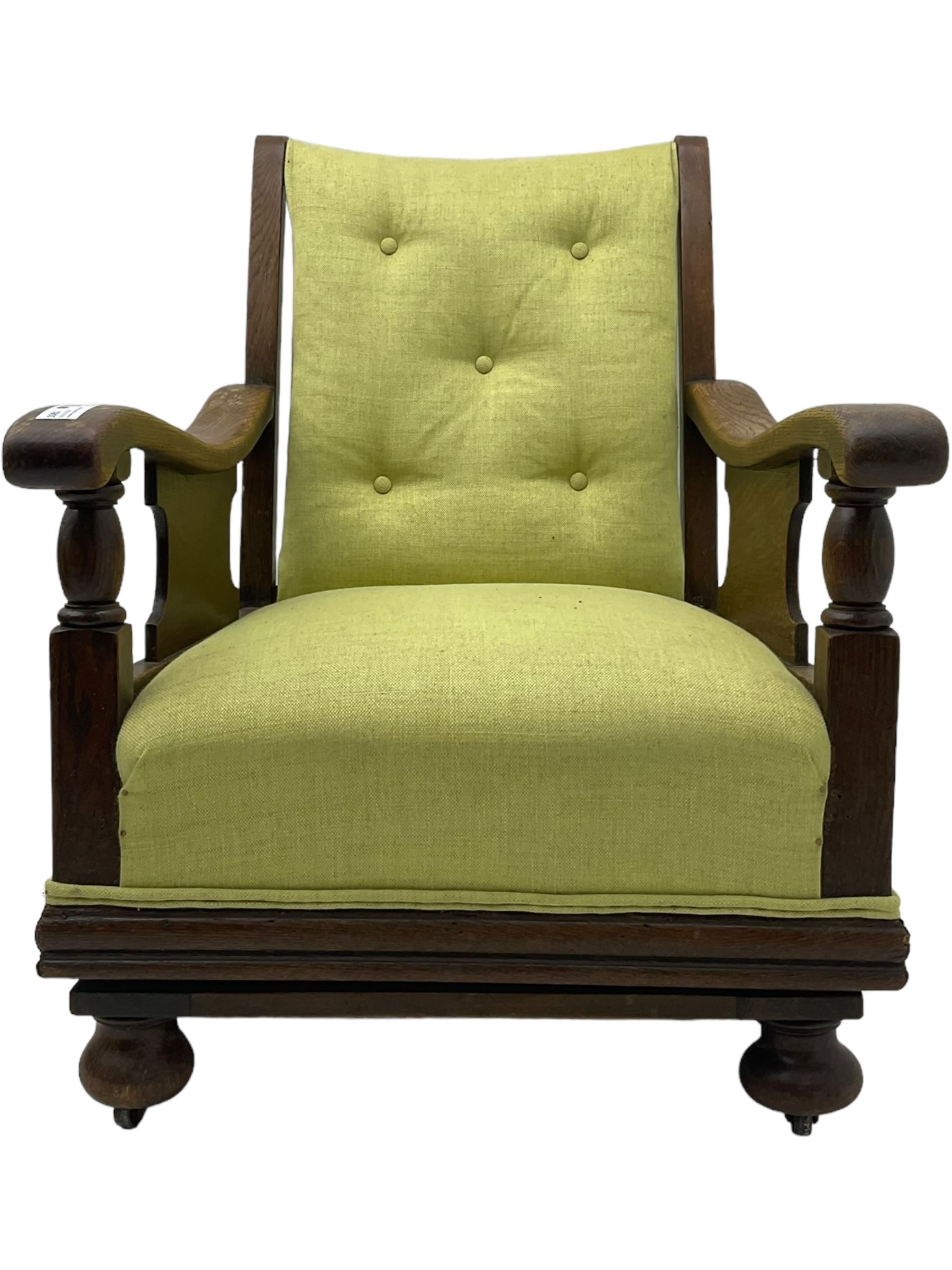 20th century oak framed rocking chair, curved armrests with shaped support panel, upholstered in lime-green fabric with button-tufting on the backrest, concealed springs to facilitate rocking motion underneath, supported by turned front legs with castors