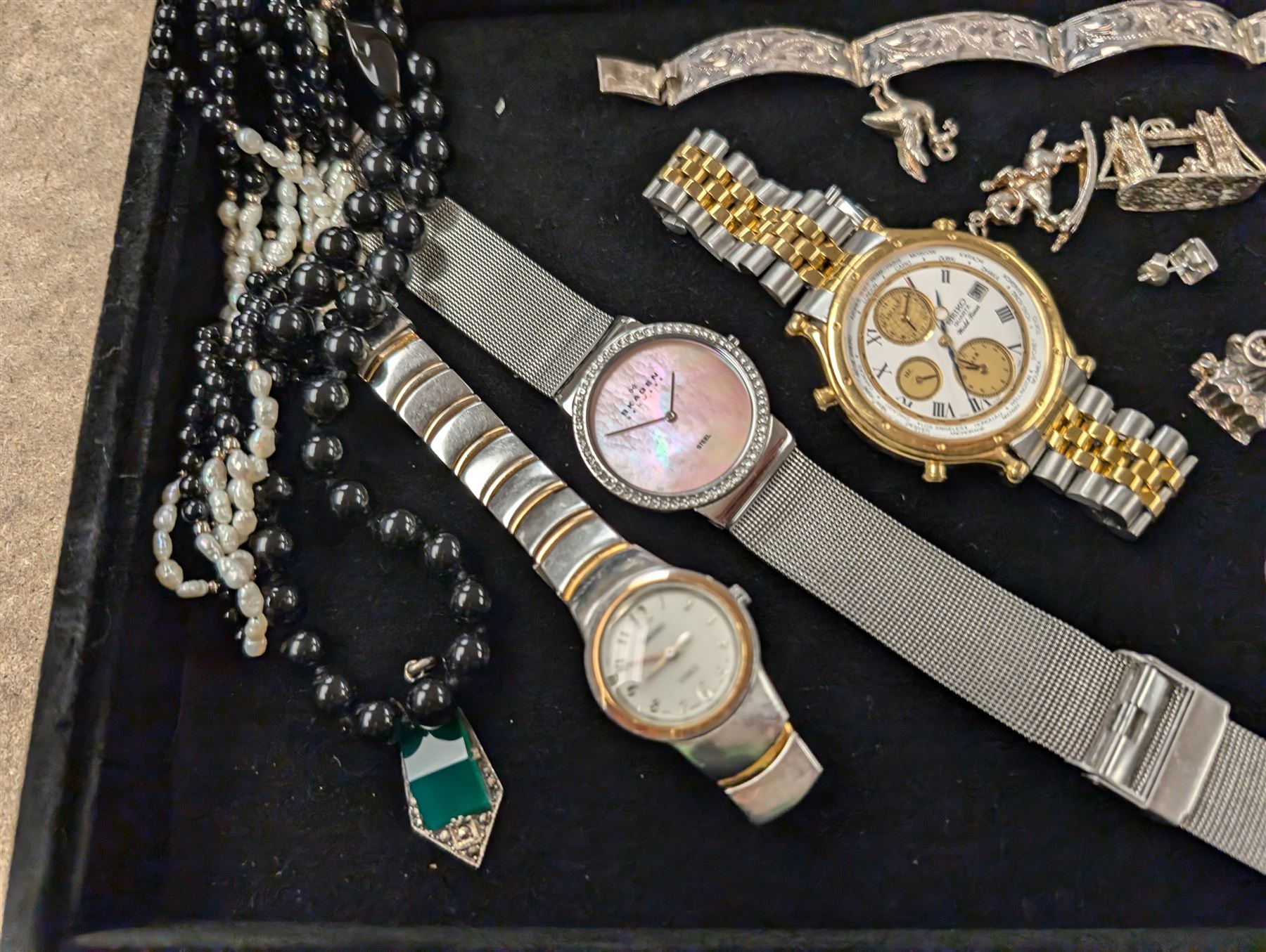 Silver jewellery, including charms, three bracelets and pendant, together with a Seiko wristwatch, Skagen wristwatch, costume jewellery and  a lighter