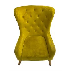 Mid-20th century design armchair, barrel back upholstered in buttoned mustard fabric, on tapering splayed front feet