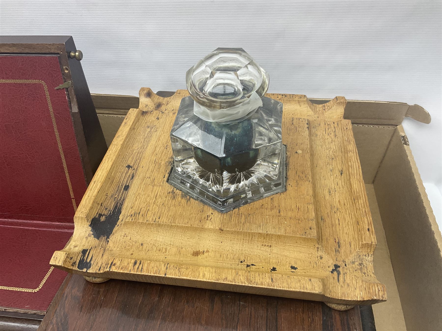 Hexagonal inkwell, in a wooden base, together with two writing slopens etc