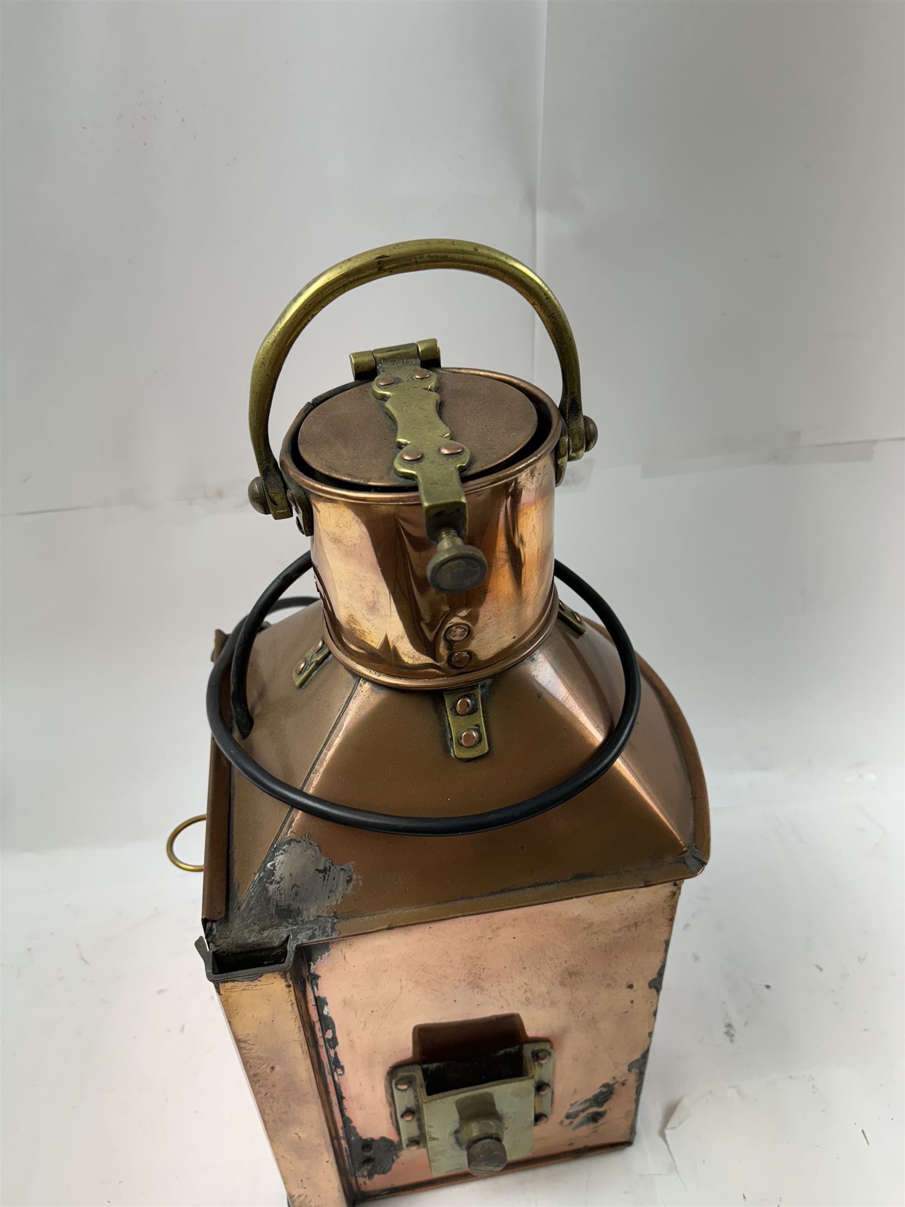 1940s copper and brass ship's corner lamp, converted to electricity, with applied plaque inscribed bow starboard patt.24, dated 1944, including handle H46cm 