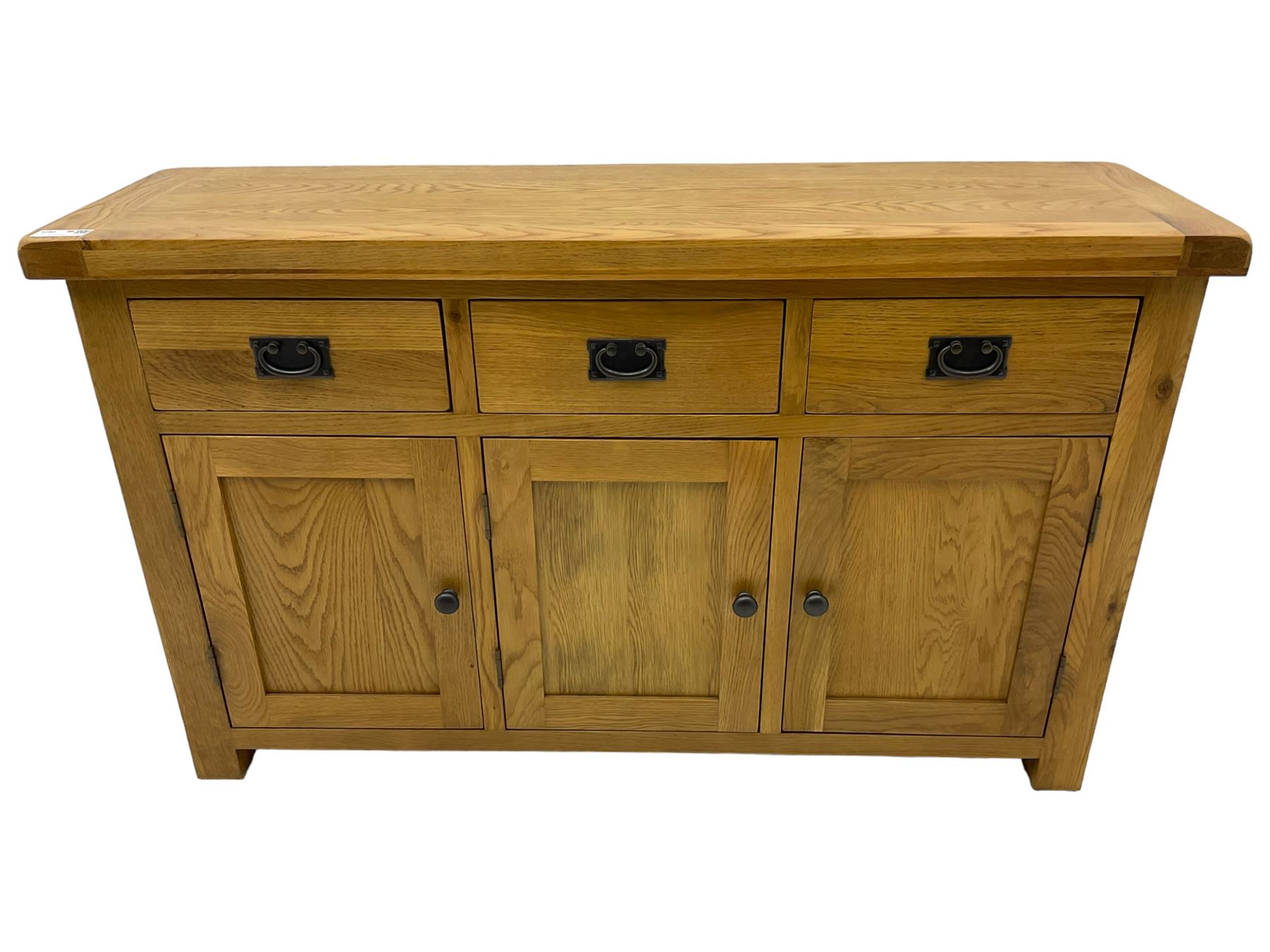 Contemporary light oak sideboard, fitted with three drawers over three panelled cupboards enclosing shelving, on square supports