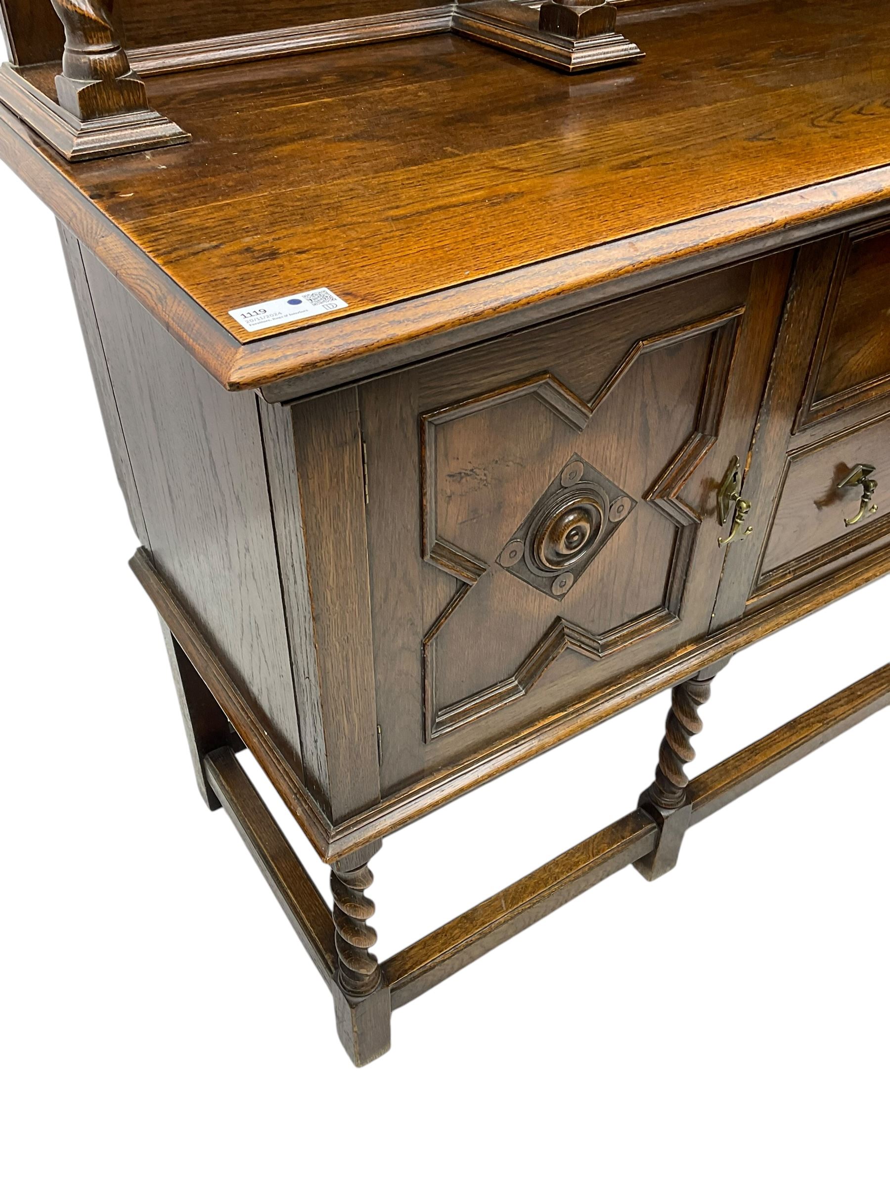 Jacobean Revival oak dresser, projecting moulded cornice over arcade carved frieze and panelled back, on spiral turned supports, moulded rectangular top over two cupboards and two drawers, on spiral turned supports united by moulded stretchers 