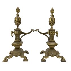 Pair of late Victorian cast and gilt brass fire dogs, circa 1894, with flaming urn finials raised upon columnar supports and four scroll feet, Rd227713, H47cm  