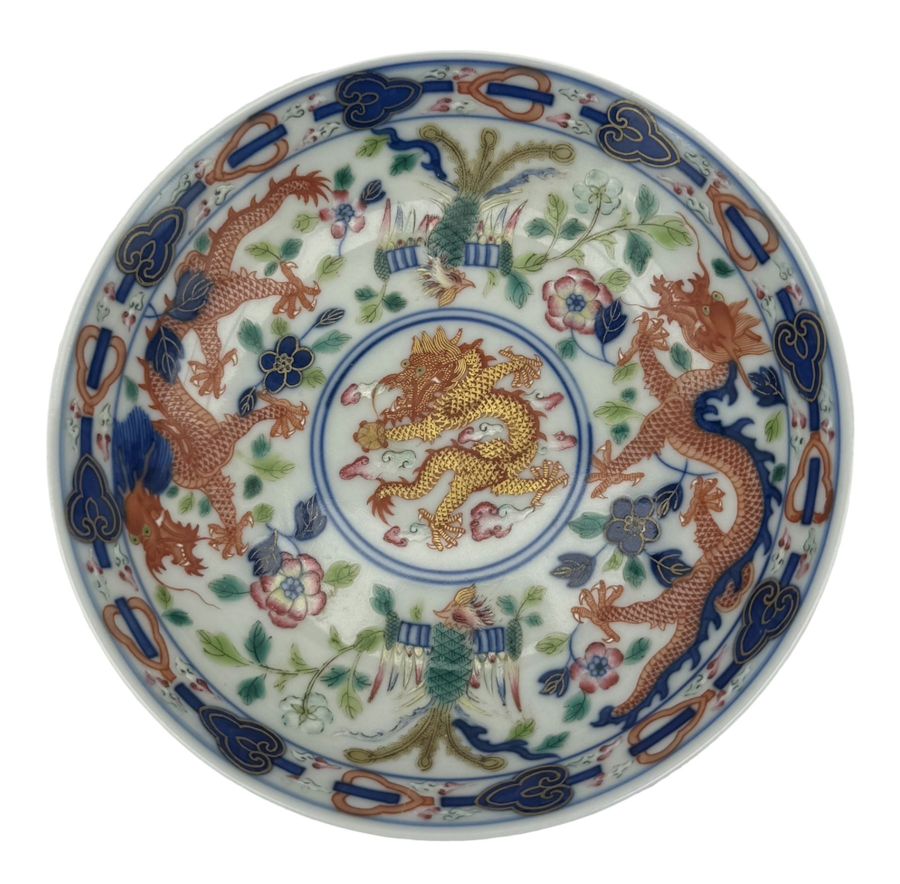 Pair of Chinese 'Dragon & Phoenix' porcelain saucers, centrally painted with a five claw dragon chasing the flaming pearl in iron red and gilt, within a border of confronting Dragons and Pheonix, amongst floral blooms, six character Guangxu mark beneath, D13.5cm