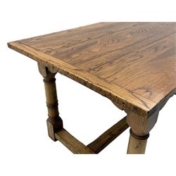 Oak refectory dining table, rectangular three plank top with cleated ends, two additional leaves, on turned supports united by H-stretchers 