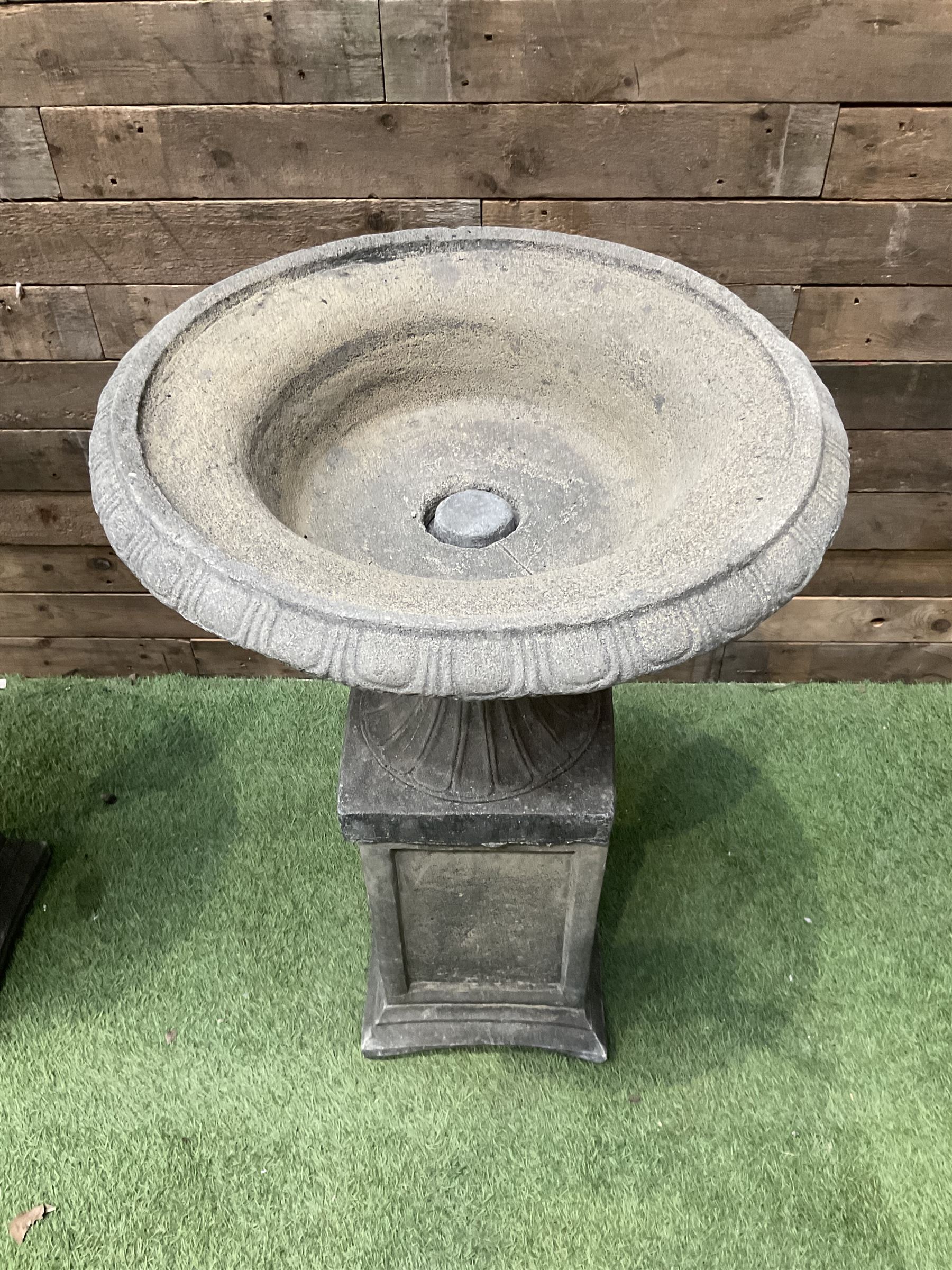 Pair of Victorian design cast stone squat garden urns, egg and dart border, raised on pedestal base and square fielded plinth - THIS LOT IS TO BE COLLECTED BY APPOINTMENT FROM DUGGLEBY STORAGE, GREAT HILL, EASTFIELD, SCARBOROUGH, YO11 3TX