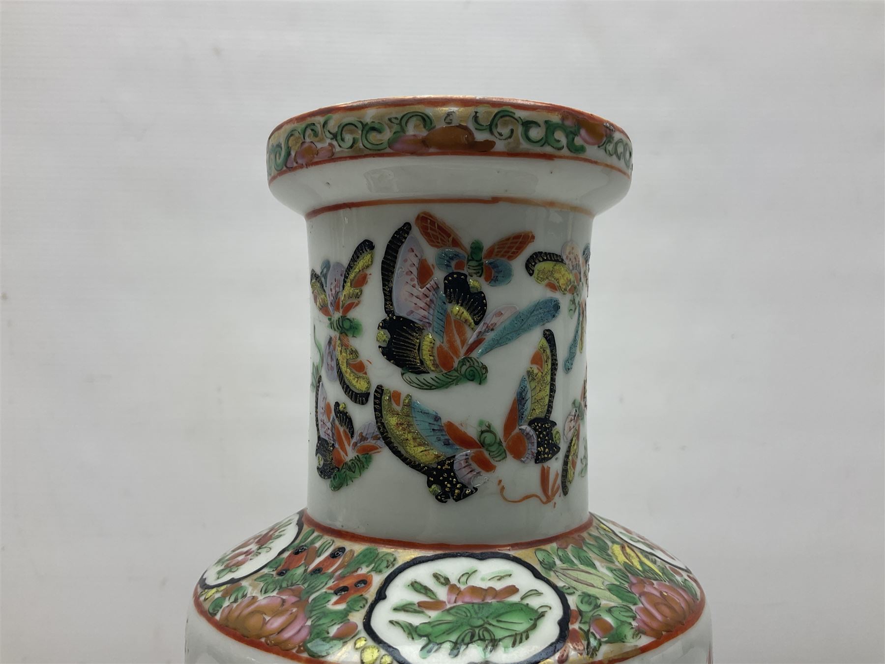 19th century Chinese Canton vase of slender baluster form, decorated with butterflies and floral panel to the neck, H30cm