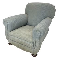 20th century traditional shape armchair, curved back and rolled arms, upholstered in light blue patterned fabric, on turned front feet