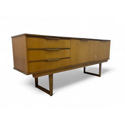 Mid-20th century teak sideboard, three drawers with integrated handles to the left, centra...