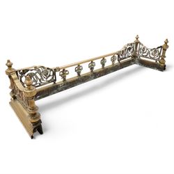 19th century brass fire fender, scrolling acanthus leaf and torch panels to the front and returns, enclosed by four reeded pillars with finials, on moulded curb base 