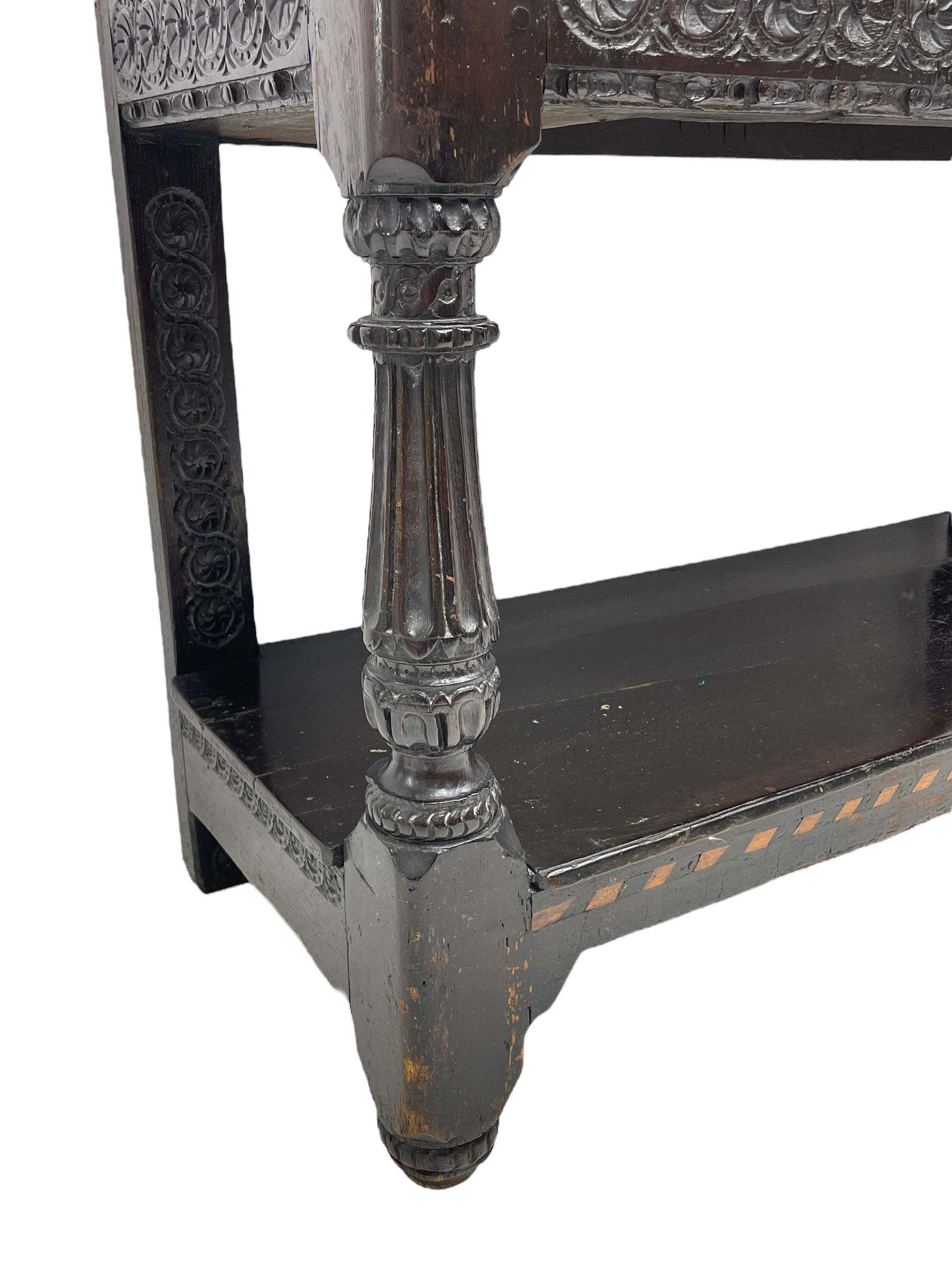  17th century oak buffet or side table, moulded rectangular top over guilloche carved frieze rails and rear upright supports, turned and flute carved front supports united by under tier