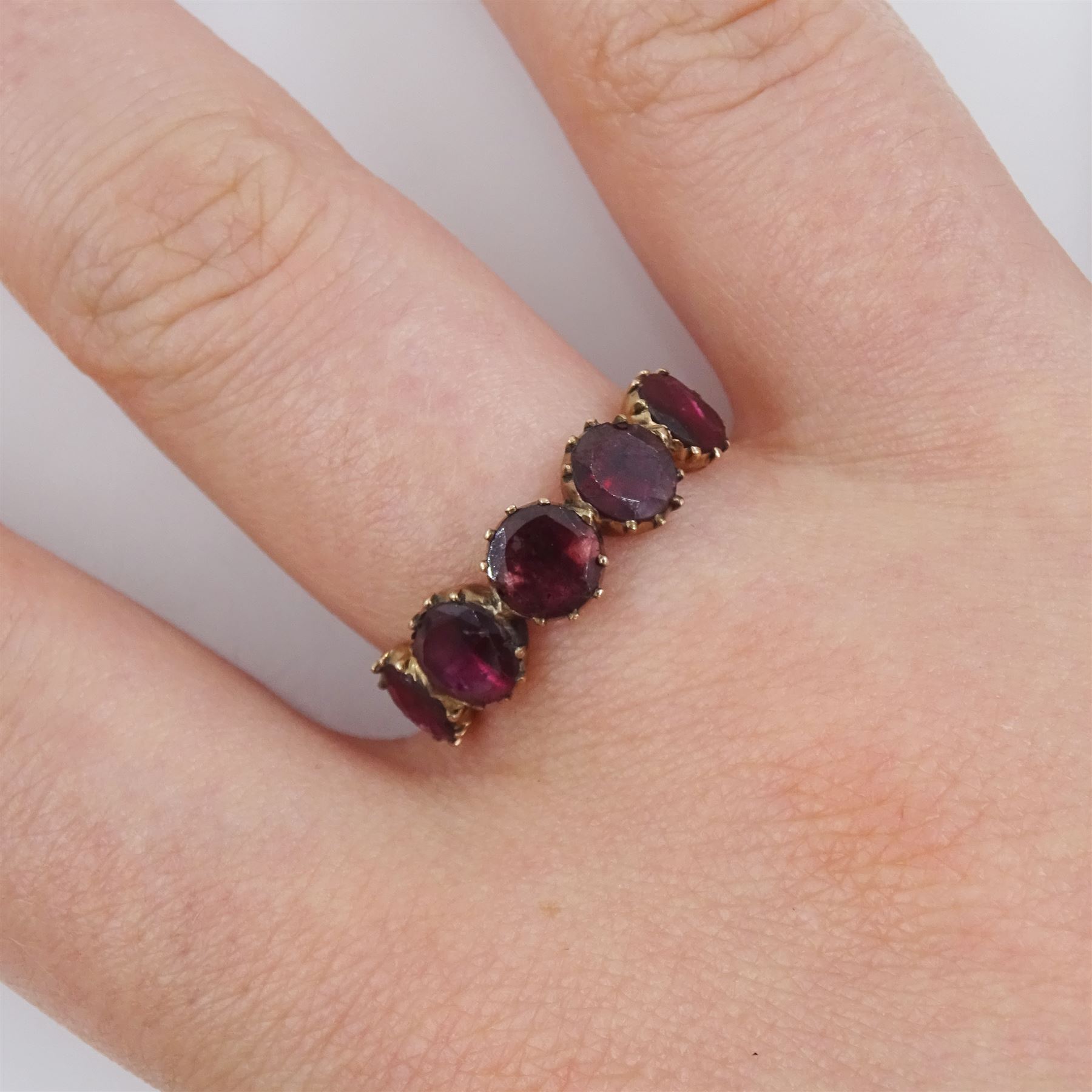 Georgian / early Victorian 9ct rose gold five stone, foiled back garnet ring