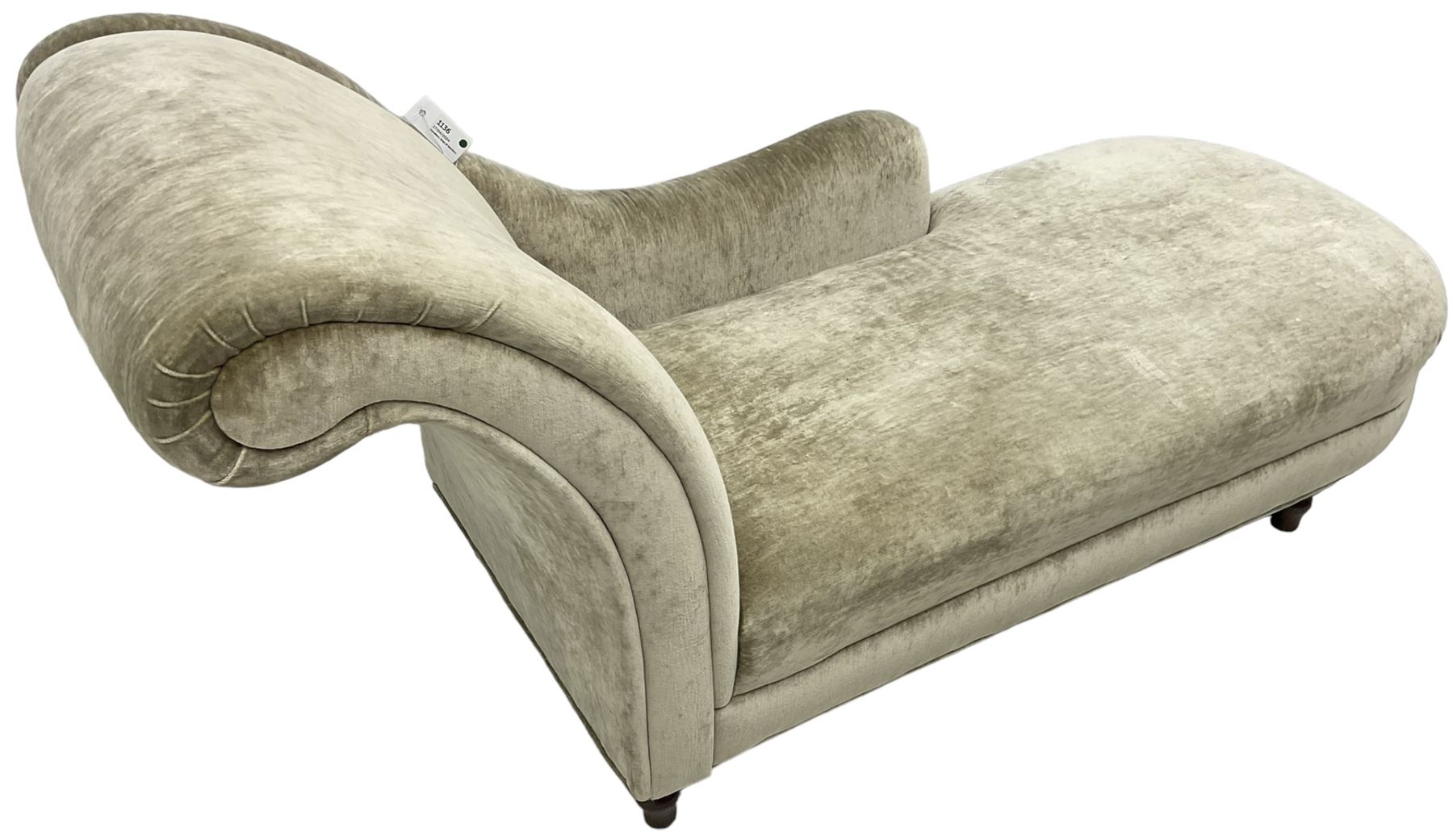 Contemporary chaise longue with scrolled back, upholstered in champagne crushed velvet, on turned feet