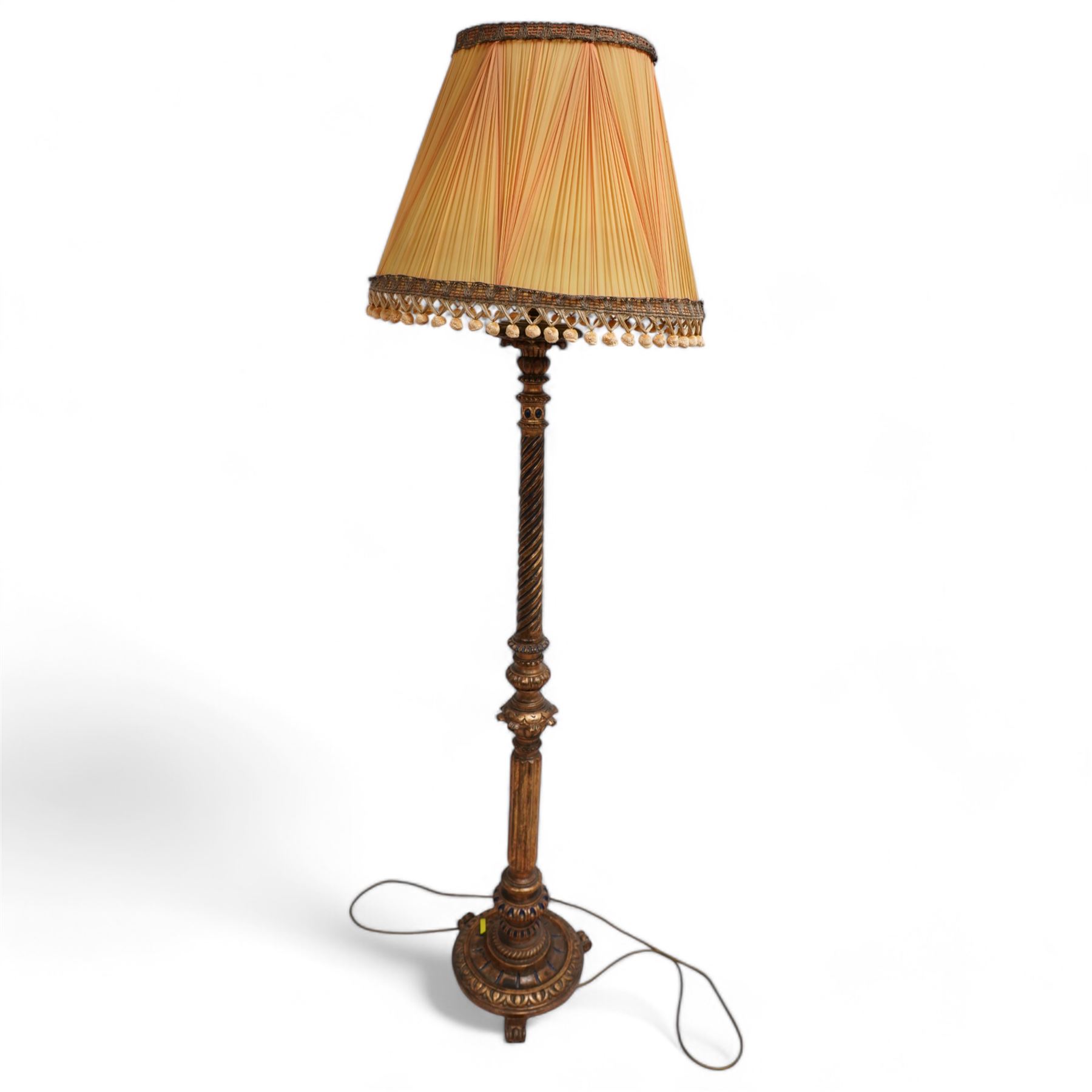 Neoclassical design gilt standard lamp, the turned ropetwist column decorated with egg-and-dart motifs and reeded elements, on circular base with scroll feet, with associated shade