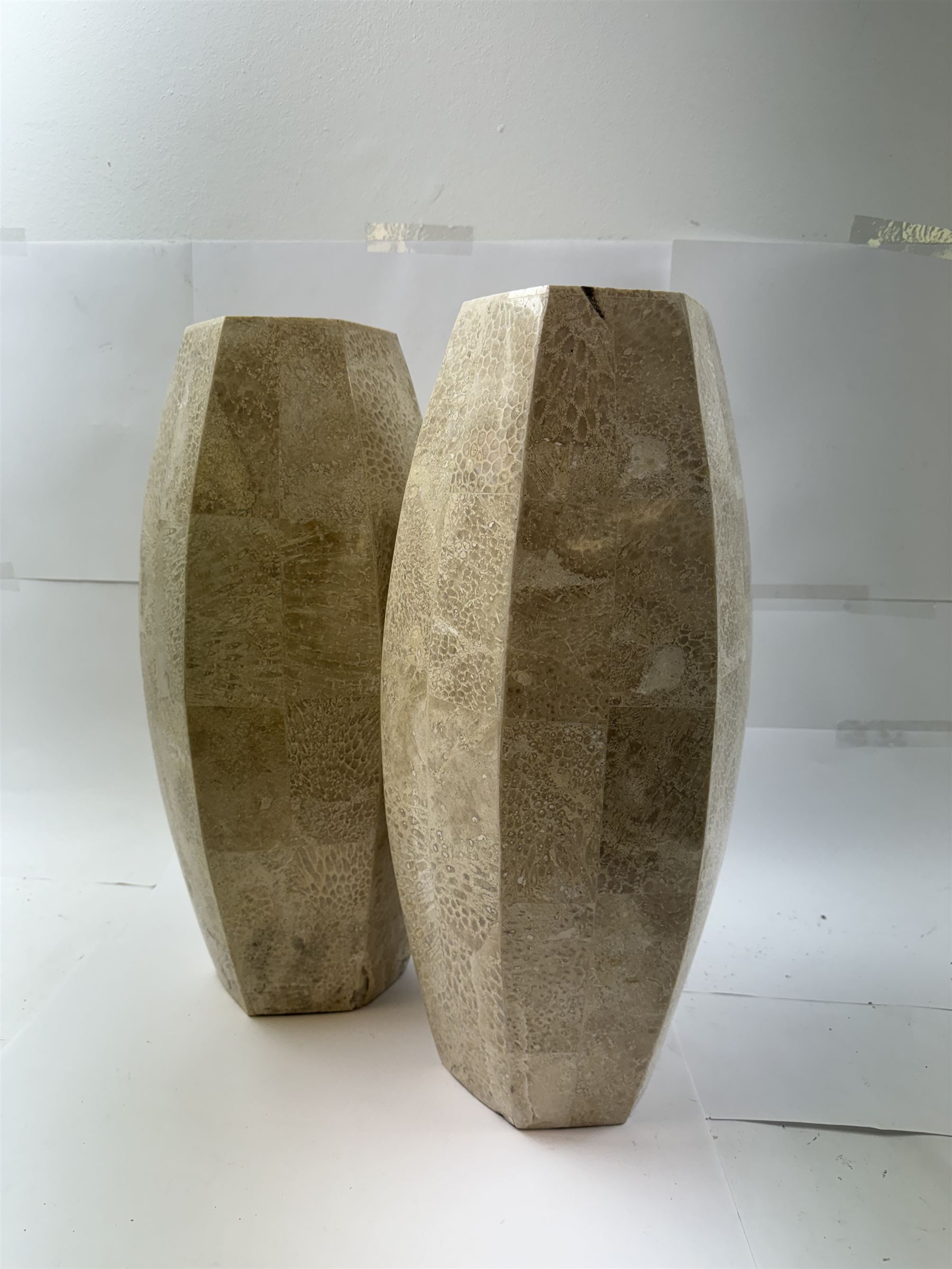 Pair of fossilised coral mosaic vases, of hexagonal form, H46cm