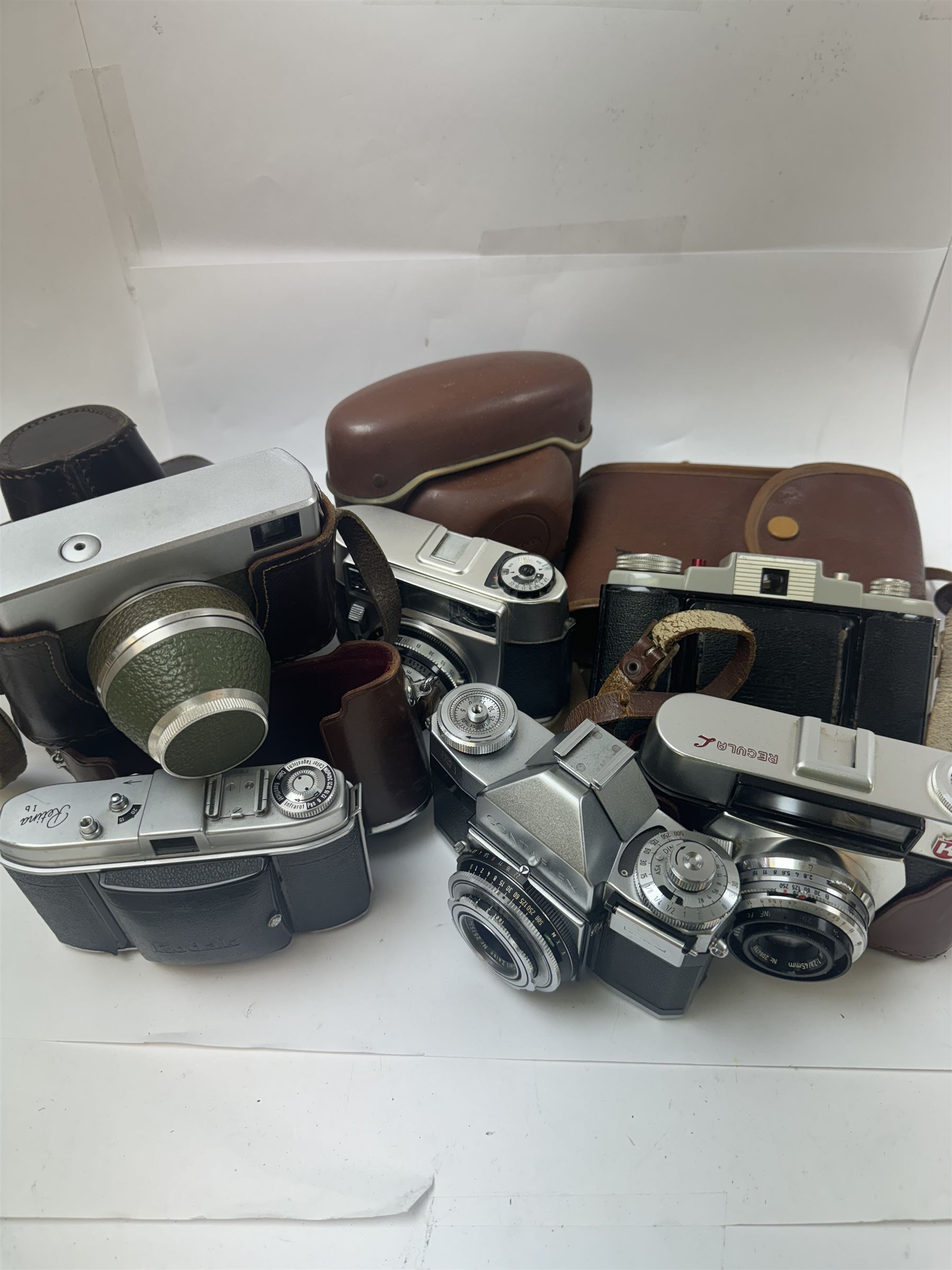 Collection of 35mm rangefinder cameras and similar, to include King Regula L, Balda Baldessa serial no. 370514, Synchro Compur MX V, Kodak Retina Ib serial no. 179811, Kodak 66 Model II and a Zeiss Ikon Contaflex, all with brown cases, with two leather camera bags and accessories