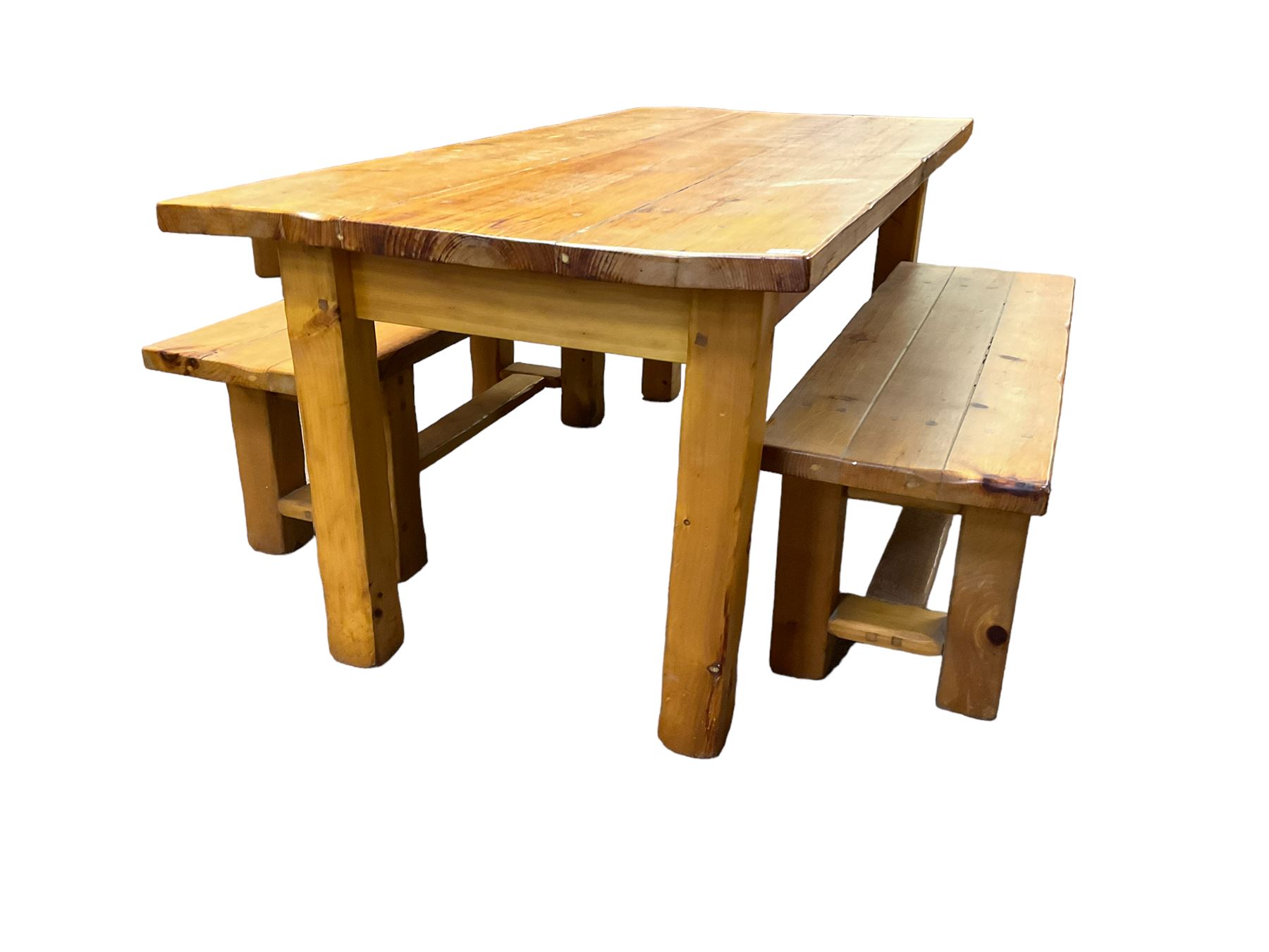 Pine dining table, rectangular plank top on square supports (181cm x 91cm, H80cm); together with two benches (133cmx 41cm, H47cm)