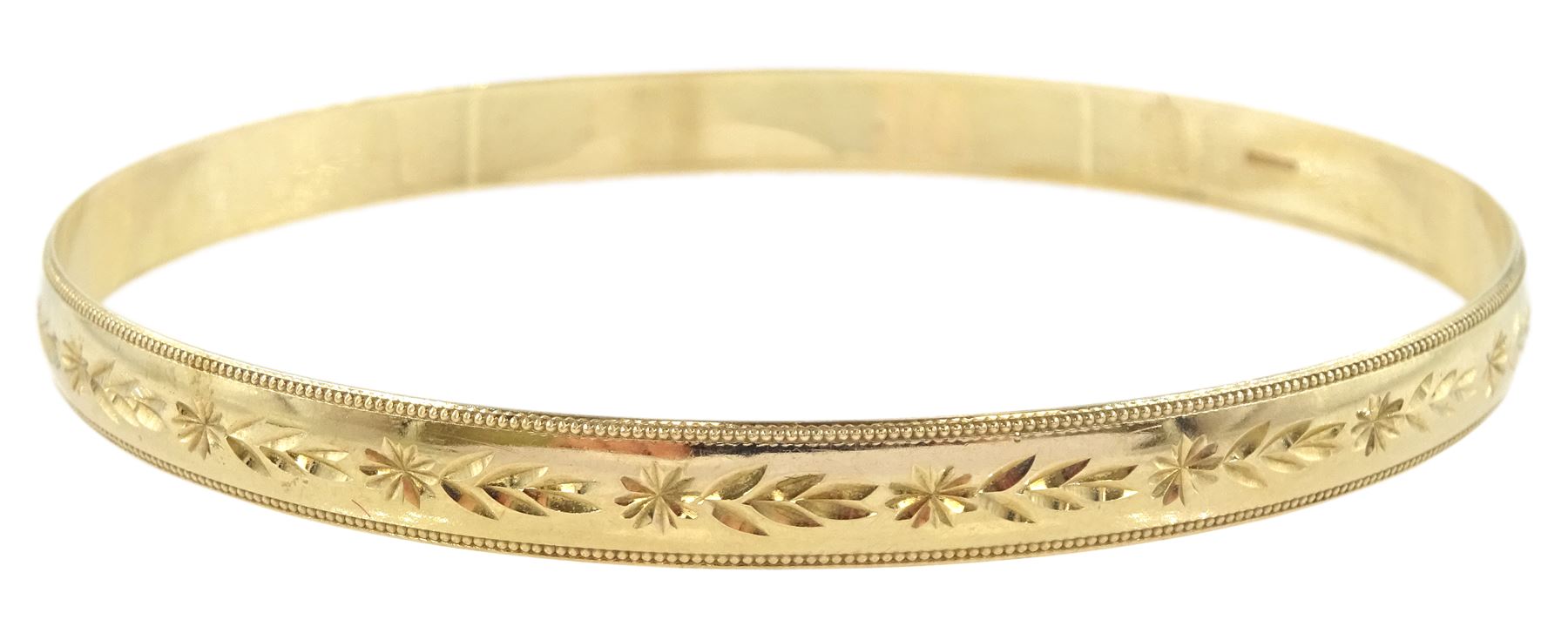 9ct gold bangle with engraved decoration, hallmarked