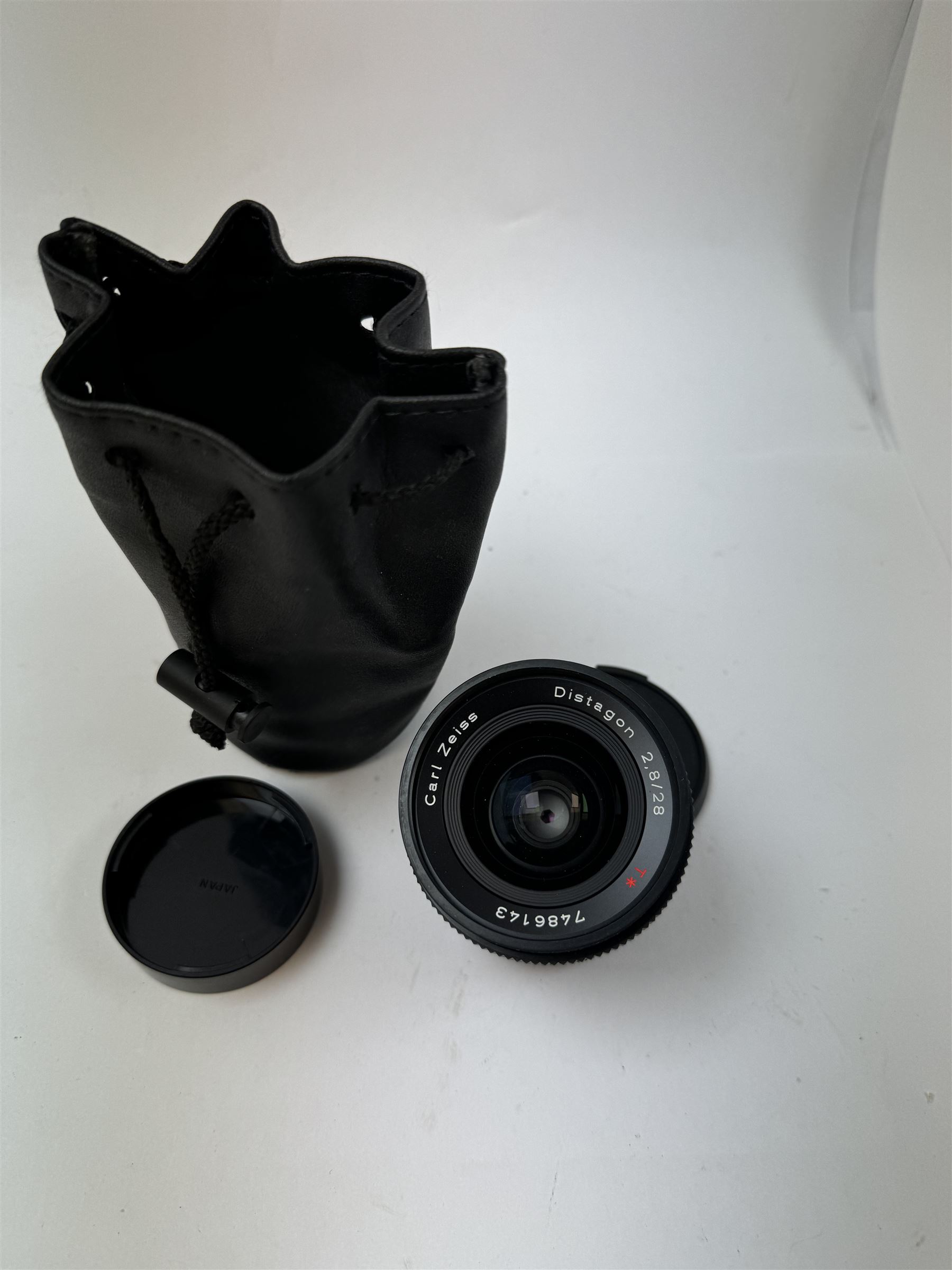 Carl Zeiss Distagon 2.8/28 T* lens, serial no. 7486143, with soft case