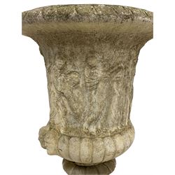 Cast stone Campana shaped urn, decorated with festival scenes over gadrooned underbelly, circular foot on square base