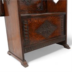 Early-to-mid-20th century carved oak monk's bench, metamorphic top with foliate lozenge carvings, over box seat with hinged lid, arcade carved lower rail on shaped feet