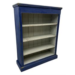 Pine blue painted open bookcase, moulded rectangular top over three white painted adjustable shelves, on plinth base